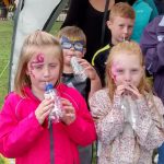 Children with recycled noise makers called tooteroos